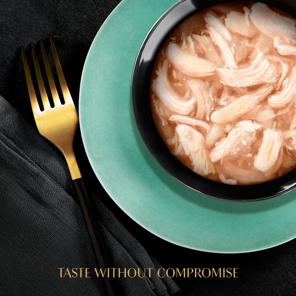 Bowl of pasta with a gold fork on a black surface, featuring the text 'Taste Without Compromise'.