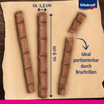 Three wooden chew sticks with measurements and Vitakraft branding on a brown background