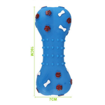 Blue dog toy with textured surface and red and white accents on a white background