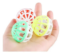 Three colorful plastic balls held in a hand