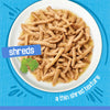 Plate of shredded food with a blue label and text on a blue background