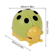 Measurement chart of a green ladybug-shaped object with black spots on a light green background