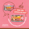 Friskies cat food can with new packaging design on a pink background
