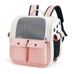 Pink and white pet carrier backpack on a white background