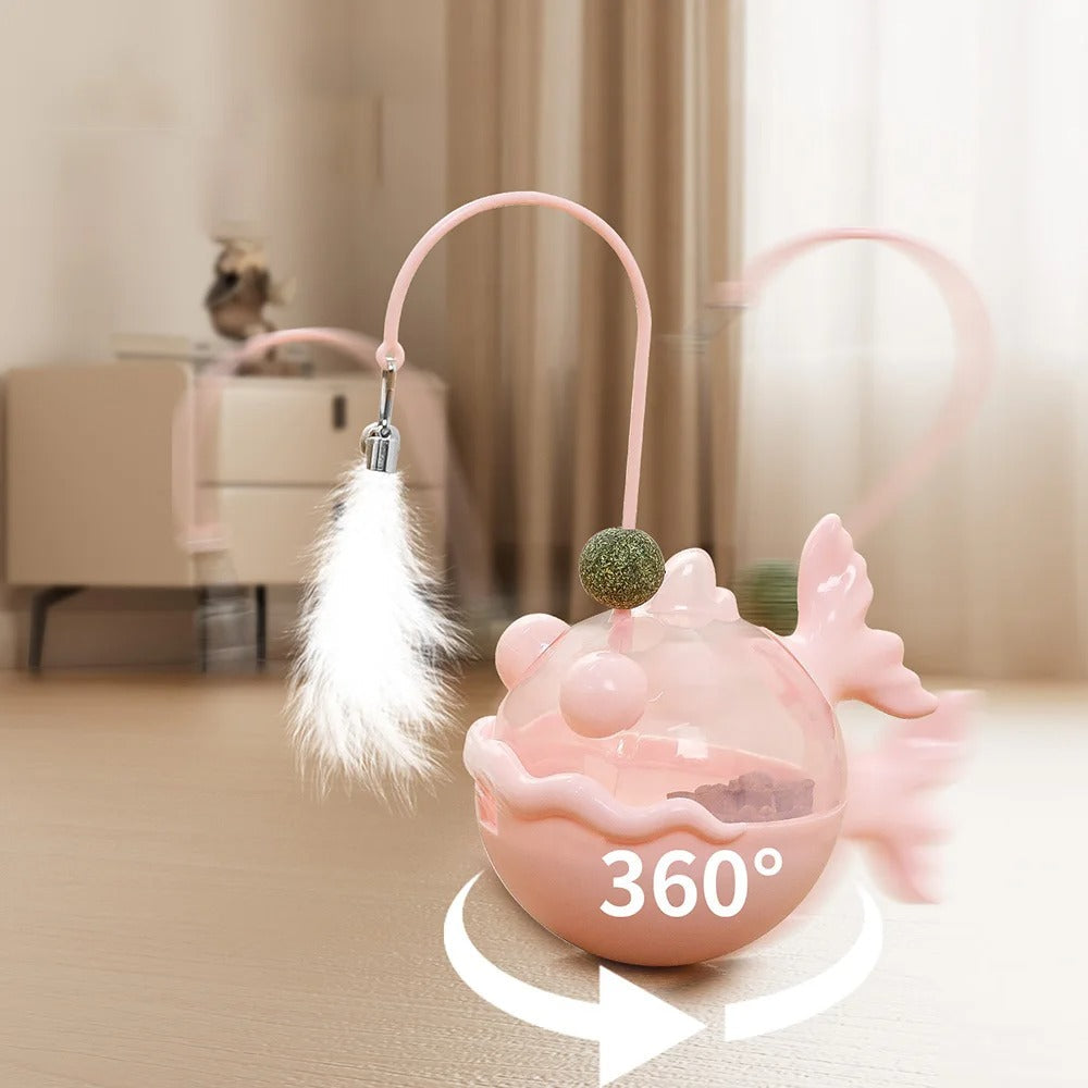 Pink pet toy with a feather and ball on a beige carpet