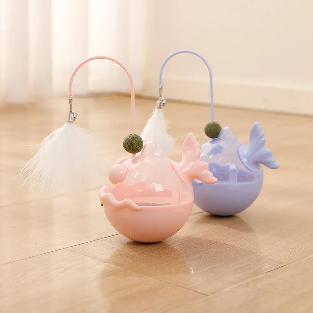 Two small, colorful animal-shaped toys on a wooden floor.