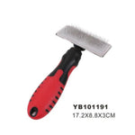 Pet grooming brush with red handle and black bristles on a white background