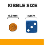 Comparison of kibble size to a blue die with measurements on a white background