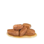 Brown dog treats on a white background