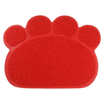 Red paw-shaped mat on a white background