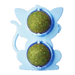 Blue cat-shaped toy with two green glittery balls on a white background