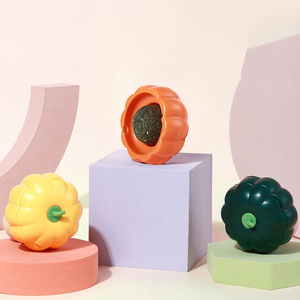 Colorful gourd-shaped objects on geometric platforms against a light pink background