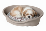 Shih Tzu Sleeping in Snake Print Bed