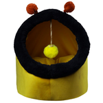 Yellow pet bed with black rim and red pom-poms on a white background