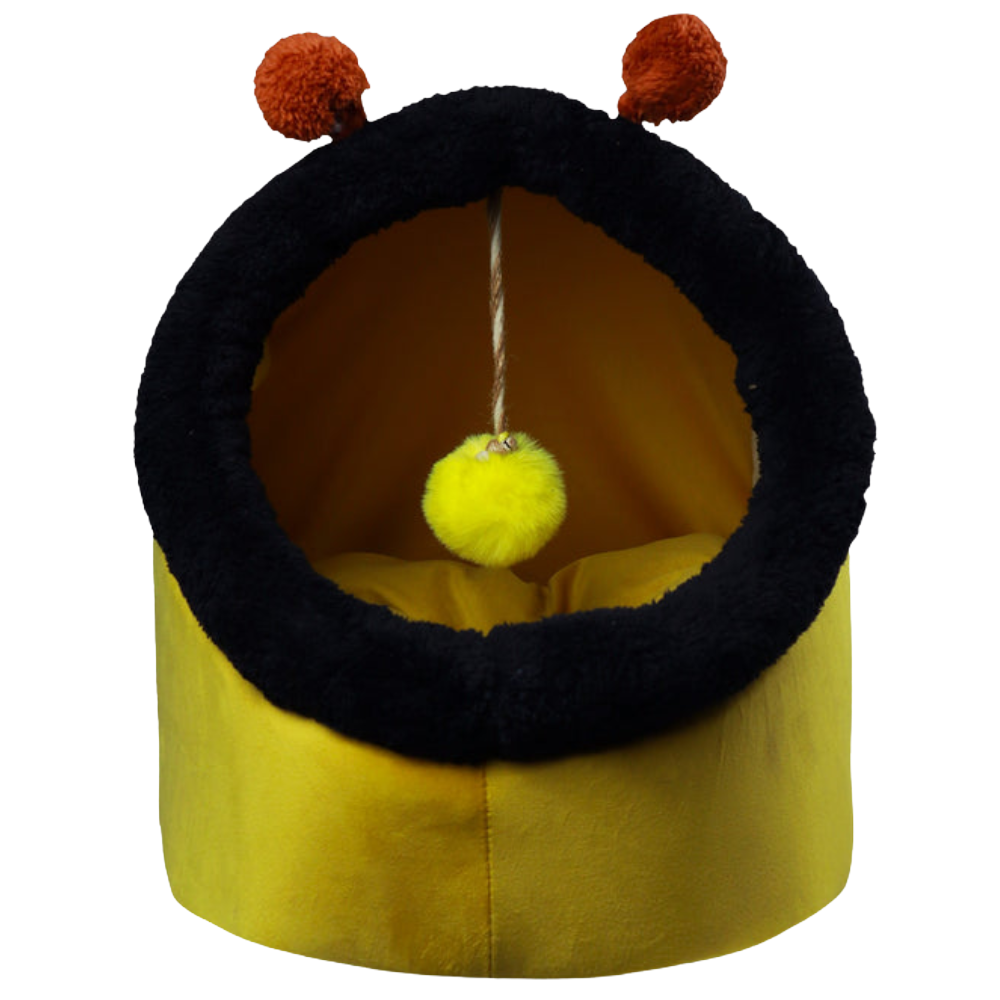 Yellow pet bed with black rim and red pom-poms on a white background