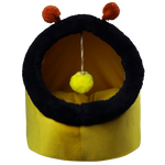 Yellow pet bed with black rim and red pom-poms on a white background