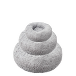 Gray plush donut-shaped pet bed on a white background
