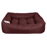 Maroon dog bed on a white background