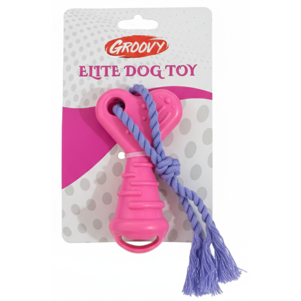 Pink dog toy with purple rope on a Groovy branded package