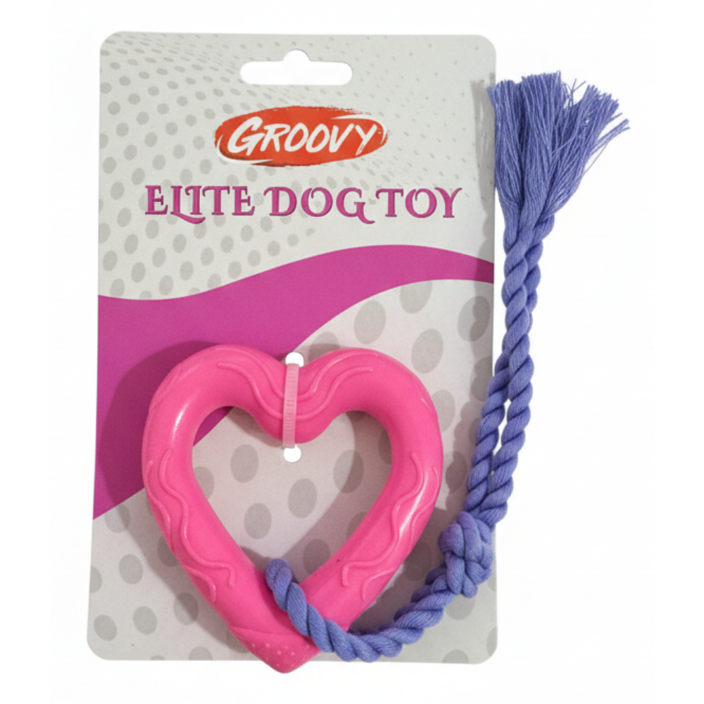 Pink heart-shaped dog toy with purple rope on Groovy packaging