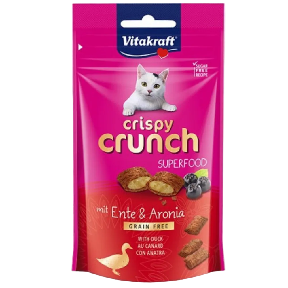 Vitakraft crispy crunch superfood cat treat package with a white cat on a pink background