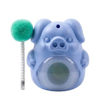 Blue dog toy with a green ball on a white background
