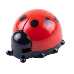 Red ladybug-shaped object on a white background