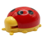 Red and yellow ladybug-shaped object on a white background