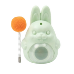 Green rabbit-shaped toy with an orange ball on a white background