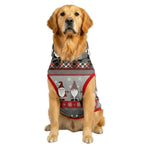 Dog wearing a festive plaid sweater with Christmas designs on a white background