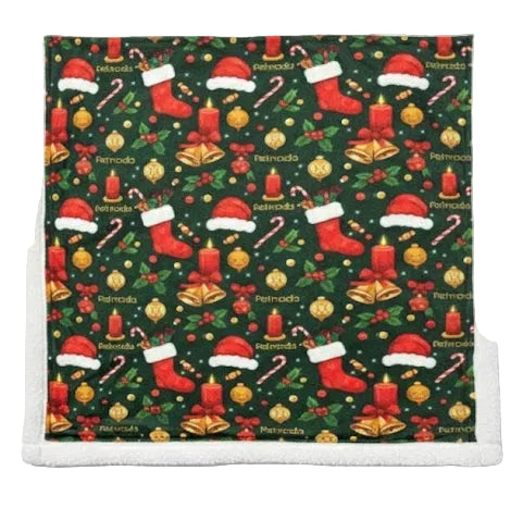 Christmas-themed patterned fabric with stockings, candles, and candy canes on a green background.