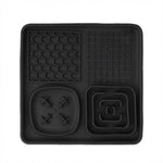 Black silicone mat with various textured patterns on a white background