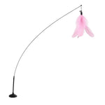 Cat toy with pink feather on a black arc stand against a white background