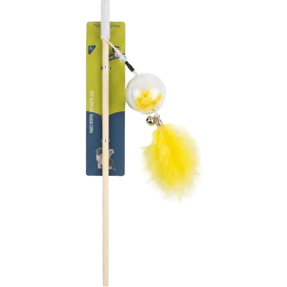 Cat toy with a yellow feather and bell on a white background