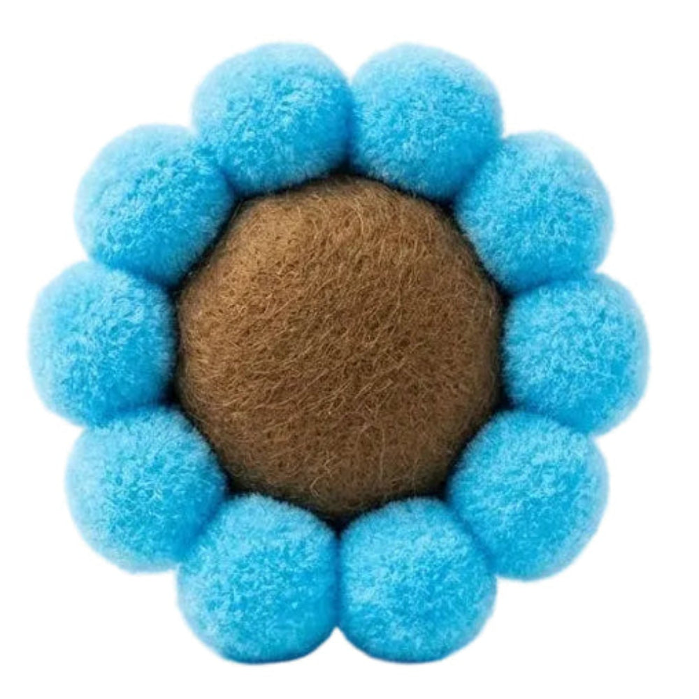 Pet toy with blue fuzzy balls around a brown center on a white background