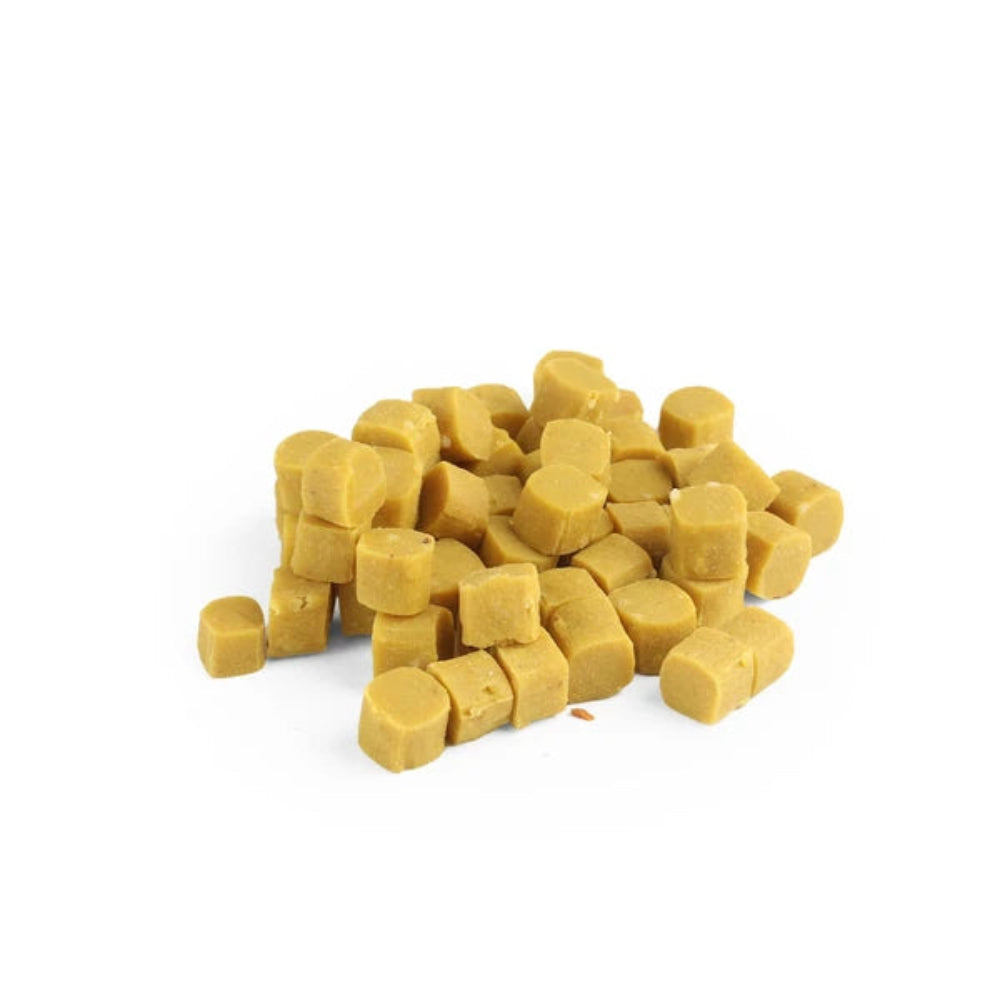Yellow dog treats on a white background