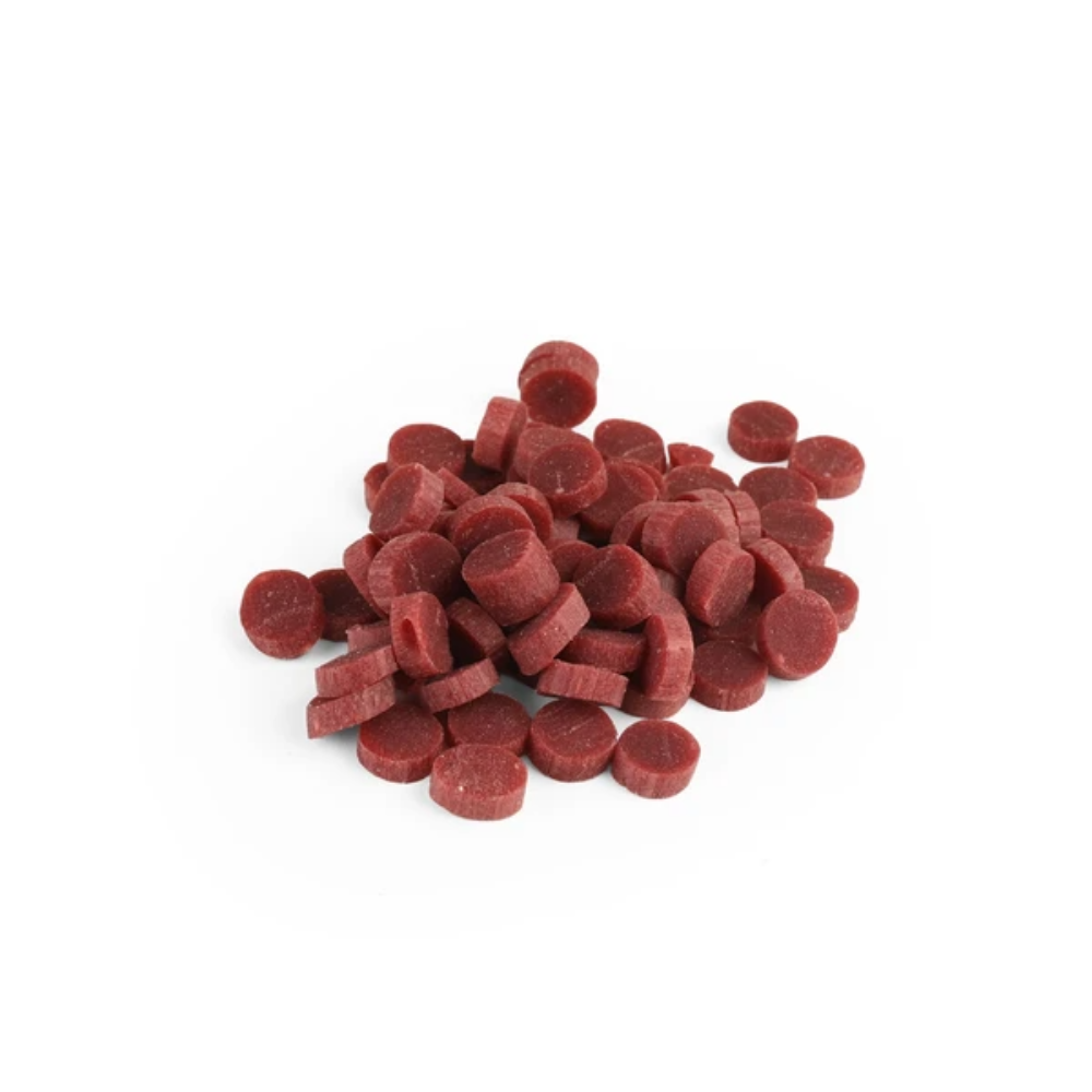 Red dog treats on a white background