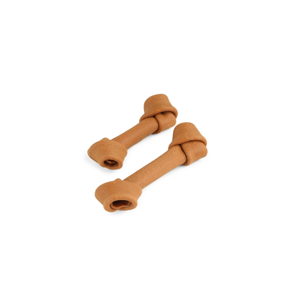 Two brown dog bones on a white background