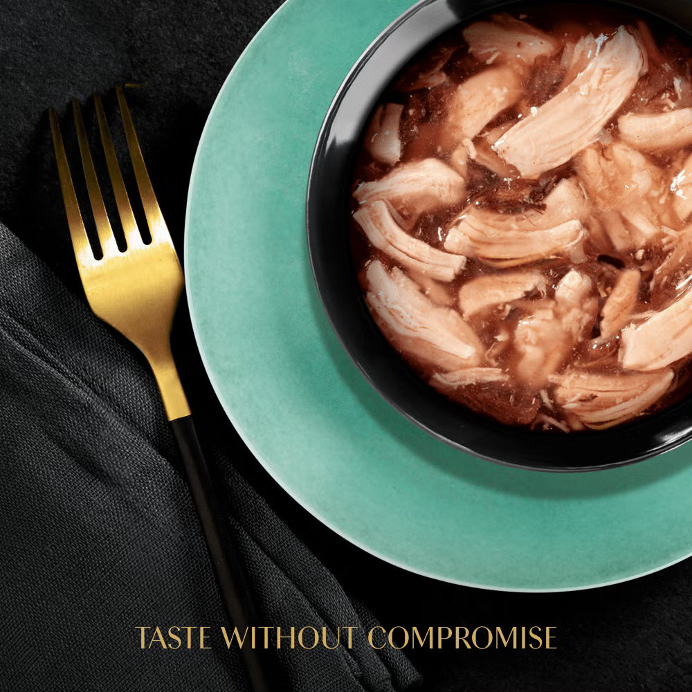 Bowl of food on a teal plate with a gold fork on a black background, featuring the text 'Taste Without Compromise'.