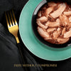 Bowl of food on a teal plate with a gold fork on a black background, featuring the text 'Taste Without Compromise'.