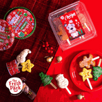 Christmas-themed treats on a red surface with 'The Fresh Pack' branding.