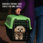 Dog in a green and black portable crate held by a person, with text about the crate's features.