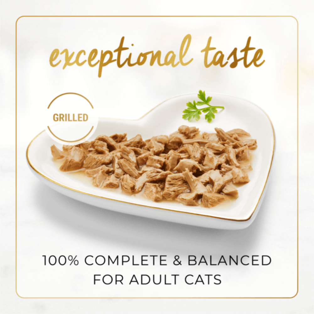 Heart-shaped plate of cat food with text about exceptional taste and balanced nutrition for adult cats.