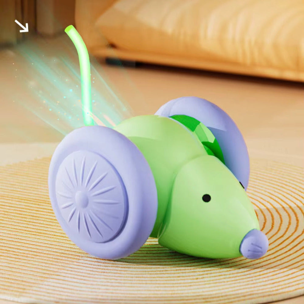Green and purple toy car with a glowing green light on a wooden surface