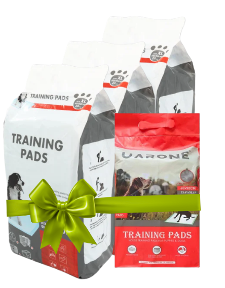 Two packages of dog training pads with a green bow on a white background