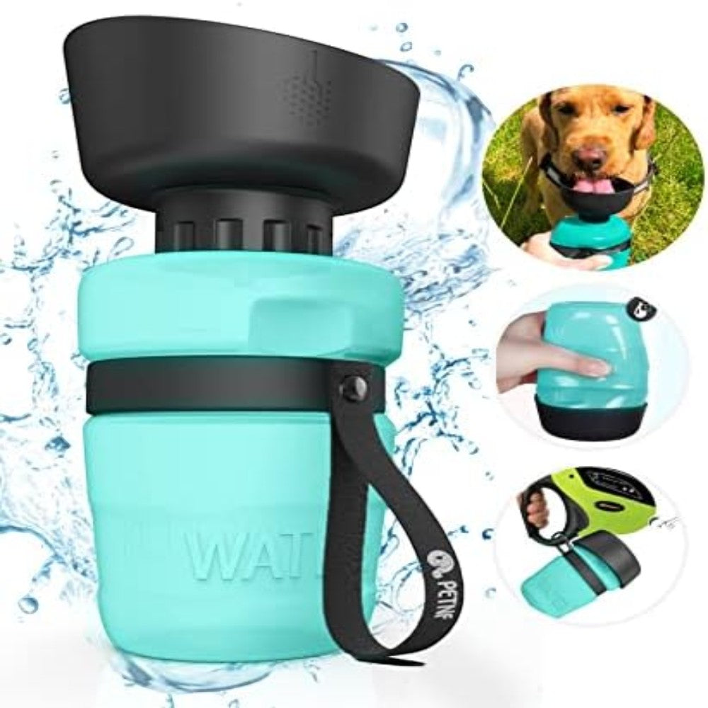 Portable dog water bottle with black cap and handle, surrounded by water droplets and a dog drinking from it.