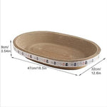 Woven pet bed with dimensions indicated on a white background