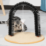 Cat playing with a black arch-shaped cat toy on a light gray surface.