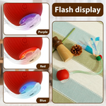 Silicone cup with colorful LED lights on a textured surface