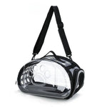 Clear pet carrier with black straps on a white background